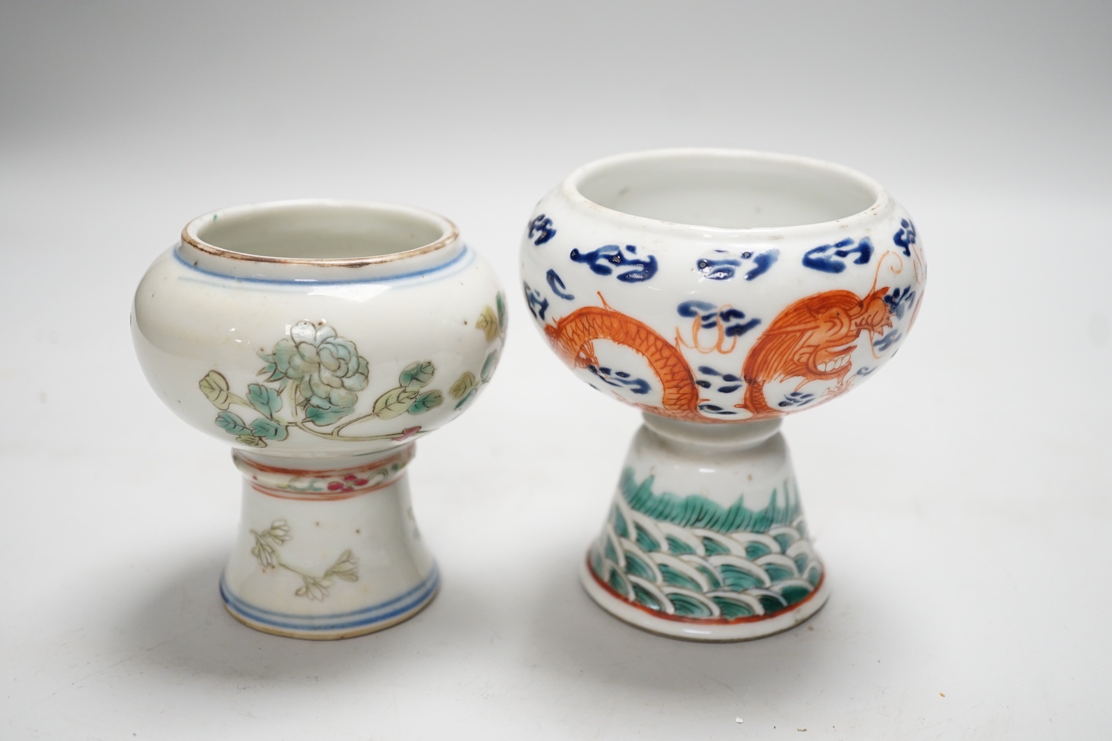 Two 19th century Chinese enamelled porcelain stem bowls, The first painted with Dragons chasing a flaming pearl, 10cm, the second painted with a bird amid flowers